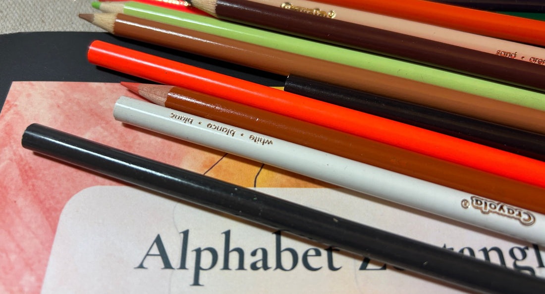 Colored pencils and coloring book on a table ready for a quiet creative moment.