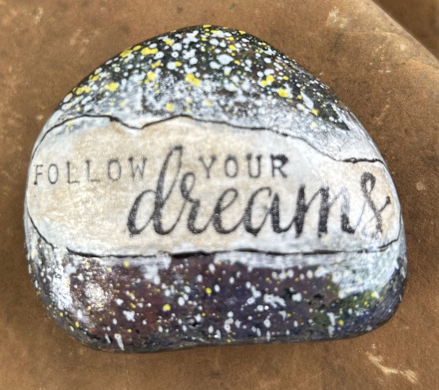 Inspirational Rock. Follow Your Dreams.white and yellow specks